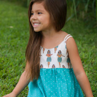 Child wearing the Hula Girls dress outside embracing island style.