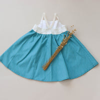 Back of the girls' rainbow dress featuring a shirred elastic bodice for a stretchy, comfortable fit.