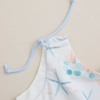 Close-up of adjustable shoulder straps on the blue starfish dress.
