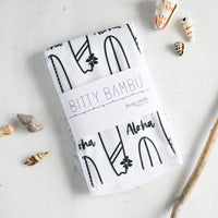 baby burp cloth in black and white with surfboards and aloha design by bitty bambu