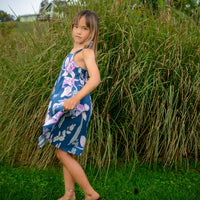 girl twirling in handmade orchid print dress
