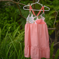Ohia print dress hanging off of ohia tree
