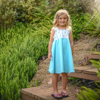 Girl wearing the Kalo Print Twirly Dress, showcasing the full skirt perfect for twirling.