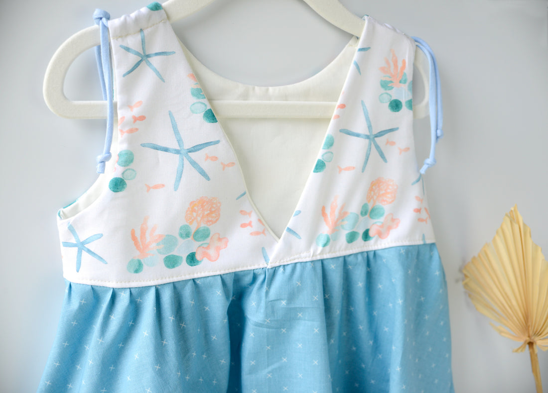 Back view of the girls' starfish dress showing the comfortable, loose fit design