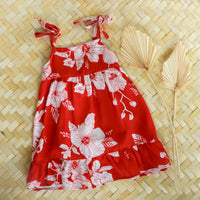 red tropical girls dress with flowers, adjustable straps and ruffled trim by bitty bambu