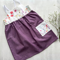 Handmade Girls' Wildflowers Dress with 'Love Her But Leave Her Wild' Quote Pocket | Shirred Back | Made in Maui, Hawaii