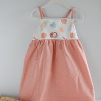 Handmade girls' 'Eternal Summer' dress with playful beachy print and shirred back, made from 100% cotton