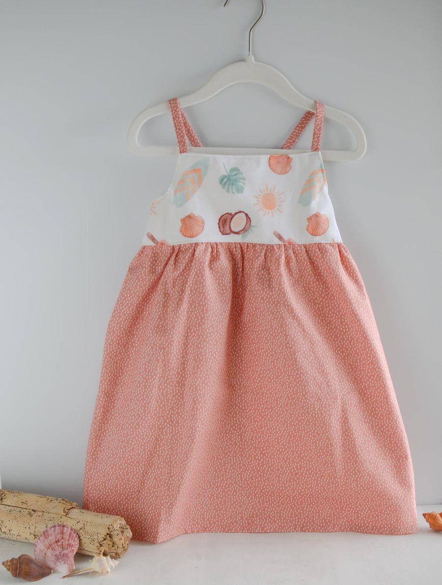 Handmade girls' 'Eternal Summer' dress with playful beachy print and shirred back, made from 100% cotton