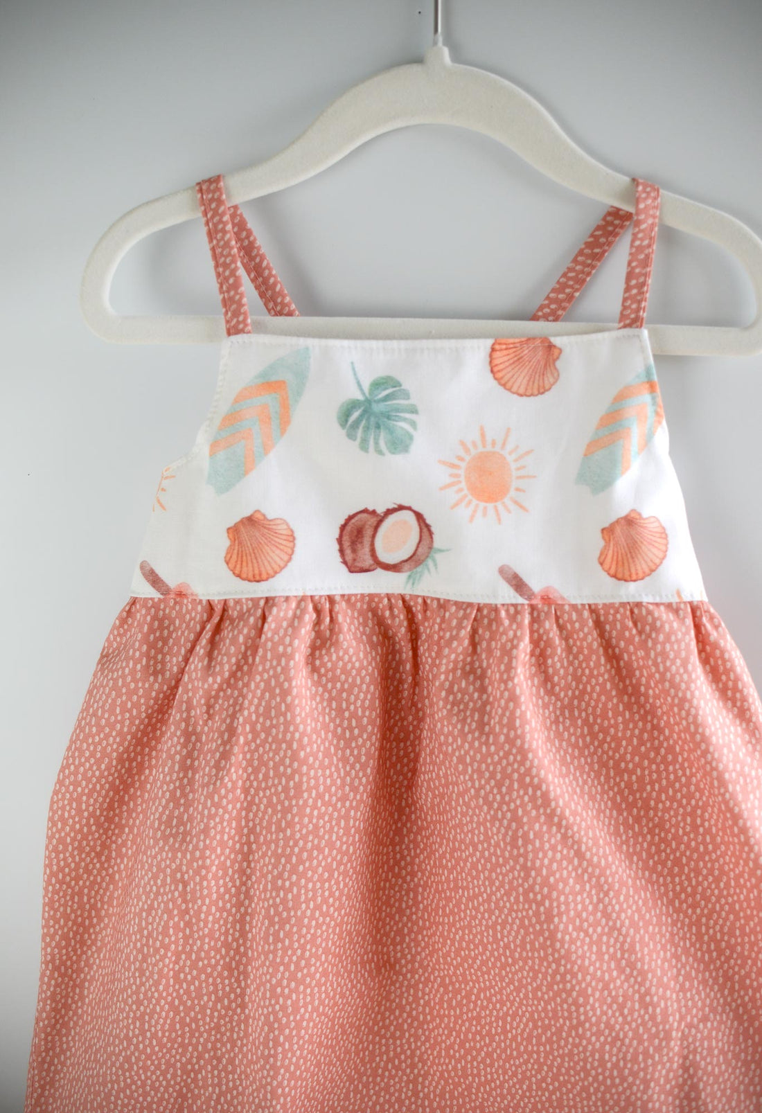 Handmade girls' 'Eternal Summer' dress with playful beachy print and shirred back, made from 100% cotton