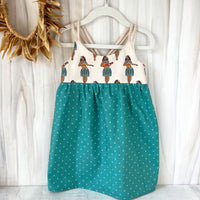 hula girls dress shown hanging featuring hula girl print by bitty bambu