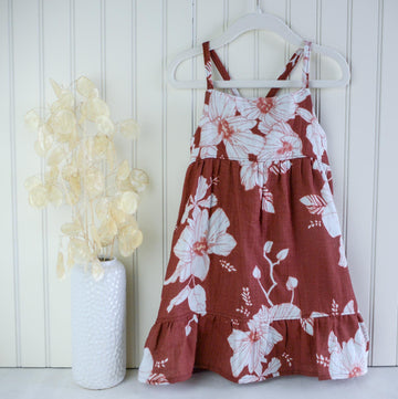 Handmade girls&#39; Hau Flower dress with adjustable straps and shirred back, made from 100% cotton double gauze fabric