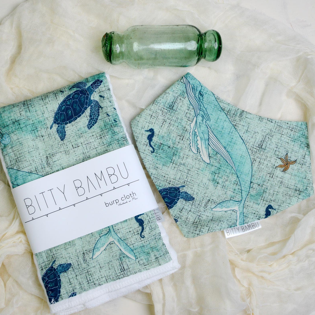 Bitty Bambu reusable products with animal designs on a textured surface